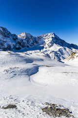 Fototapeta na wymiar Snowy Italian Alps Sulden, Solda with Ortler, Zebru, Grand Zebru in background. Val Venosta, South Tirol, Italy.
