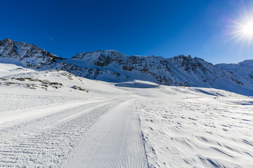 Ski slopes and ski lifts in the Alps.
