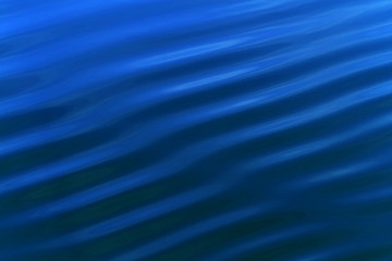 Obraz premium ripple a small wave or series of waves on the surface of water, especially as caused by an object dropping into it or a slight breeze.