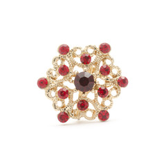 golden round brooch with rubies isolated on white