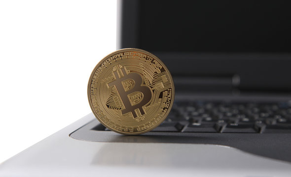 gold bitcoin on laptop. cryptocurrency finance