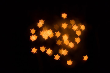 The Golden glare in the form a stars.  A festive kaleidoscope, a bright light. Abstract composition...