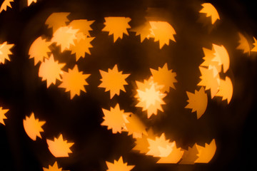The Golden glare in the form a stars.  A festive kaleidoscope, a bright light. Abstract composition...