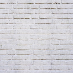 square part of old white painted brick wall