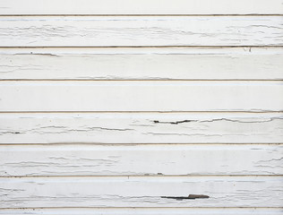 Obraz premium peeling white paint on horizontal wooden planks of shed wall