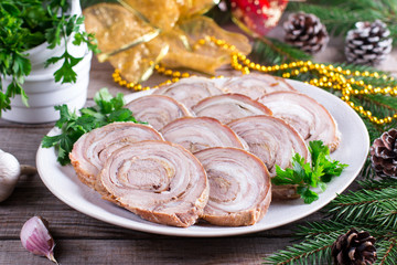 Obraz na płótnie Canvas Roasted pork roll. New year's appetizer