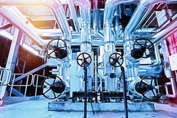 Equipment, cables and piping as found inside of a modern industrial power plant