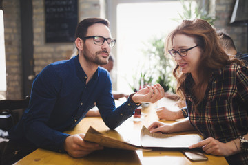 Couple eating out and dating in restaurant