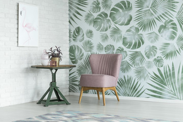 Floral room with pink chair