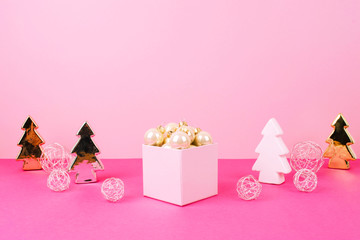 Christmas tree balls on a pink background