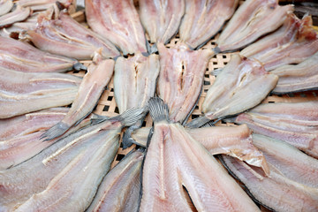 Closeup dried fish sell on the street market, traditional preserved food in Thailand