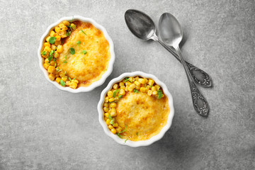 Ramekins with corn pudding on table