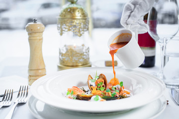 Chef s specialty presented in restaurant on served table