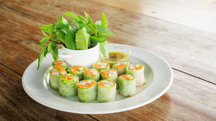 Fresh spring rolls with assorted vegetables with spicy sauce.