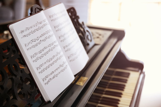 Music sheets on piano