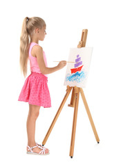 Naklejka premium Cute little girl painting picture on canvas against white background