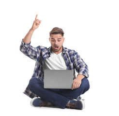Young man with laptop, isolated on white