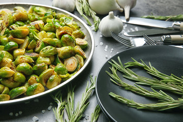 Metal tray with roasted brussel sprouts on table