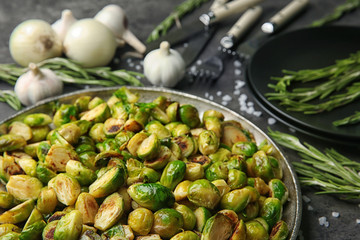 Metal tray with roasted brussel sprouts on table