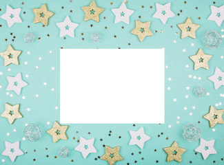 Christmas decorations on mint background.