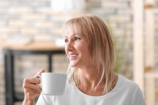 Beautiful Mature Woman With Coffee At Home