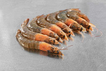 Many fresh shrimps on table