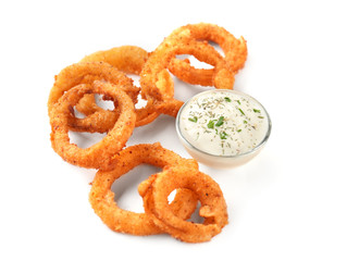 Fried onion rings with sauce on white background