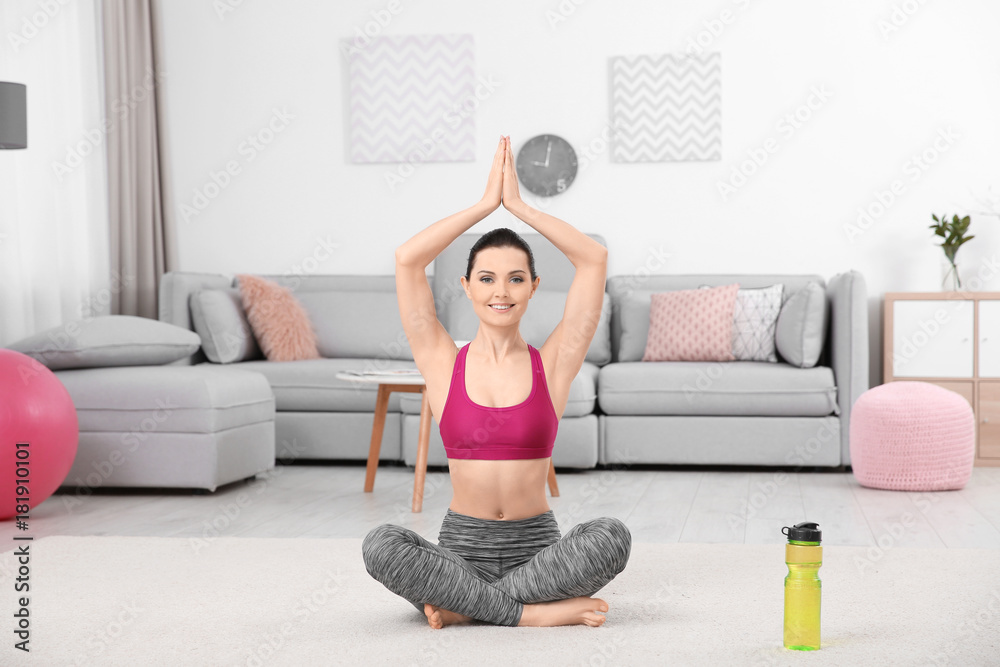 Poster young sporty woman doing exercise at home