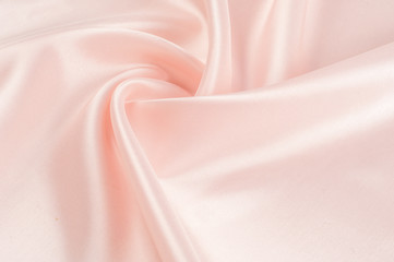 Texture, background, pattern. Fabric silk pink background. Beautiful pink satin. Drapery...