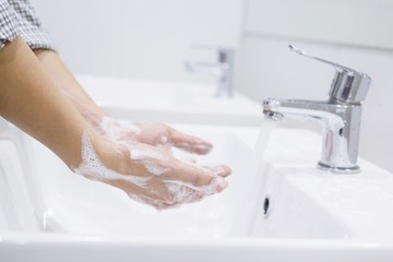 Hygiene. Cleaning Hands. Washing hands with soap under the faucet with water Pay dirt.