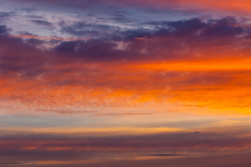 Naklejka na ściany i meble Texture, background, pattern. Evening, morning sky, bright colors on the clouds.Colorful sky and sunrise. Natural landscape. Early morning sky with colors from deep blue to orange.