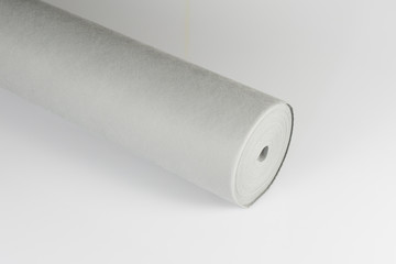 a grey tablecloth in roll of paper