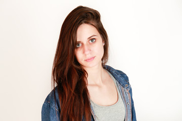 A lovely smiling girl on a white background