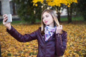 Happy teen girl smile during walking on autumn park