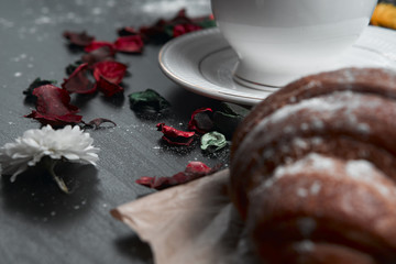 coffee and croissants on black background