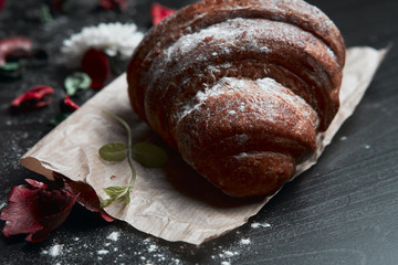 coffee and croissants on black background