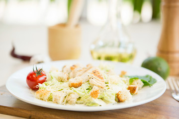 Homemade Vegetable salad with chicken and cheese on table