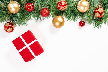 Branches of spruce with gold and red balls and gifts, isolated on white background. Isolate.