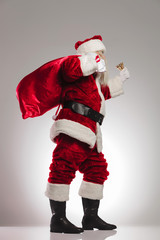 side view of santa claus ringing bell