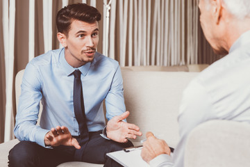 Excited Young and Senior Businessman Negotiating