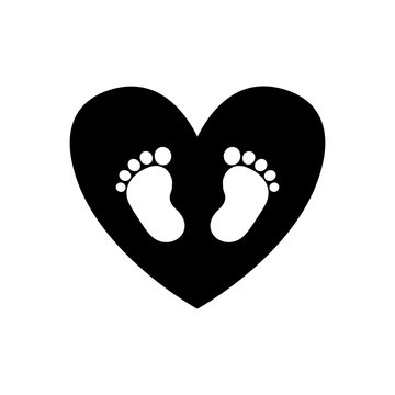 Baby footprints inside of black heart icon isolated on white background.