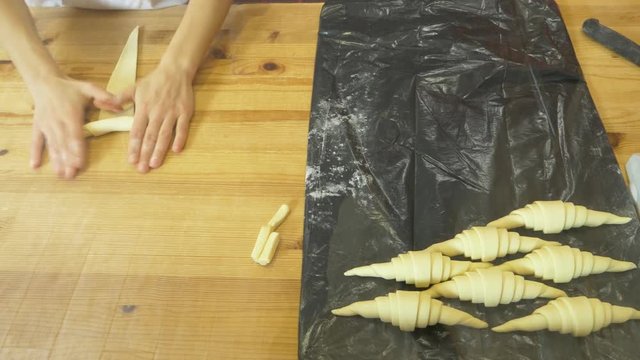 hands of the chef prepare croissants. 4k