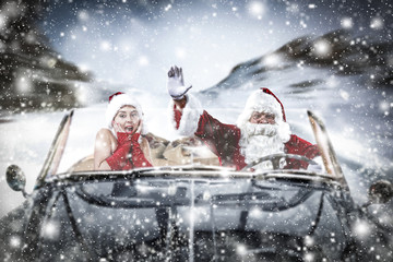 santa claus car and few people 