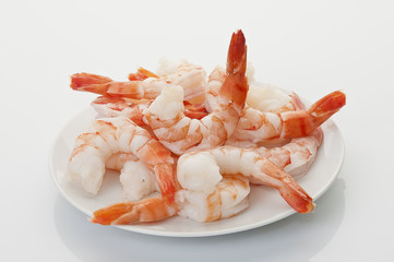 Jumbo Head Less Cooked prawns on white plate on white background