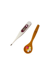 Tablets in spoon and thermometer isolated on white background. Colorful pills. Medical concept