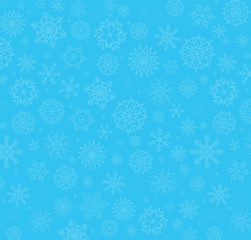 Winter blue background with fallen snowflakes.