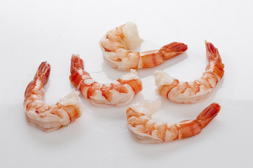 Jumbo Head Less Cooked prawns on white plate on white background