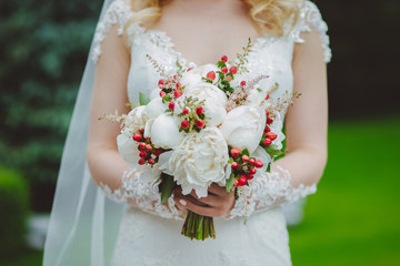 Bride with a white peony wedding bouquet