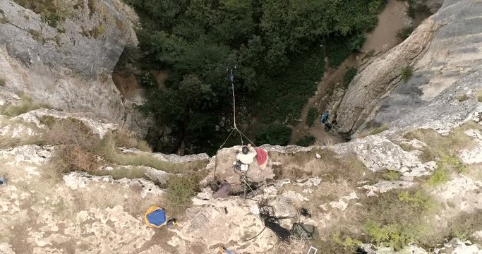 Bungee jump in a cave. Aerial view, 4k superwide