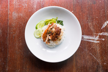 Roasted duck with rice on the wooden table